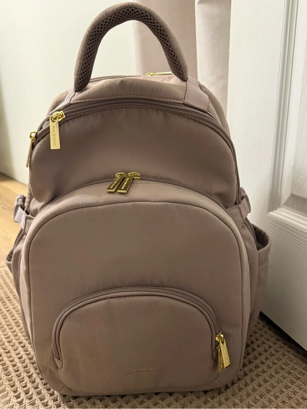 Isaac Mizrahi taupe colored backpack